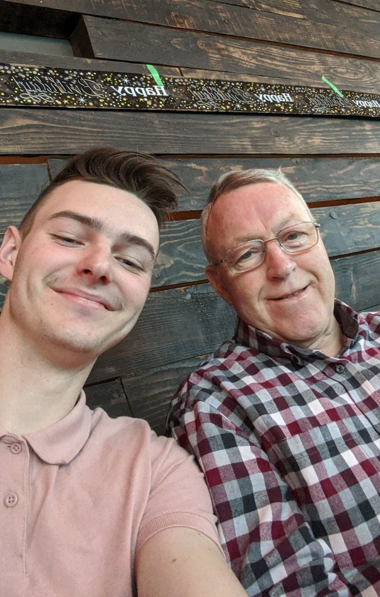 A selfie of me and my grandpa, both smiling.