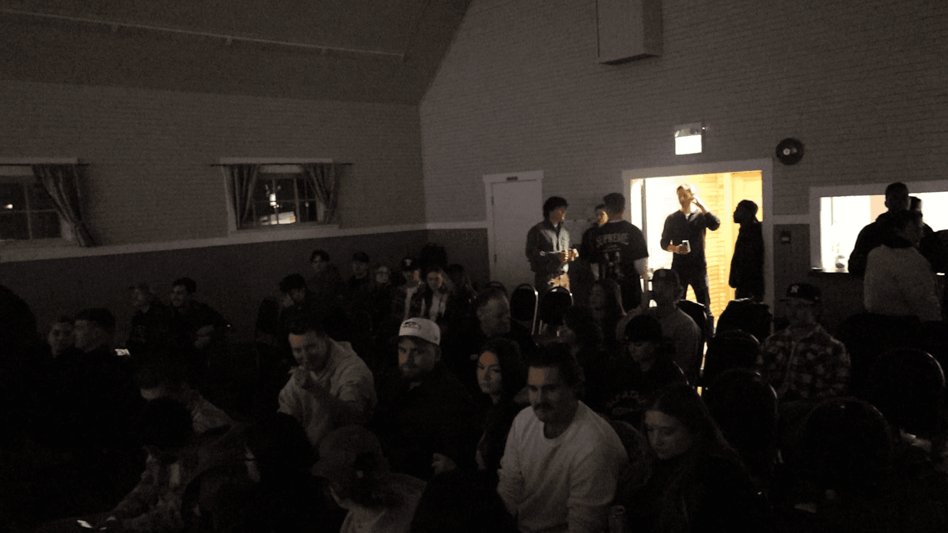 The hall filling up before the show, people finding their seats.