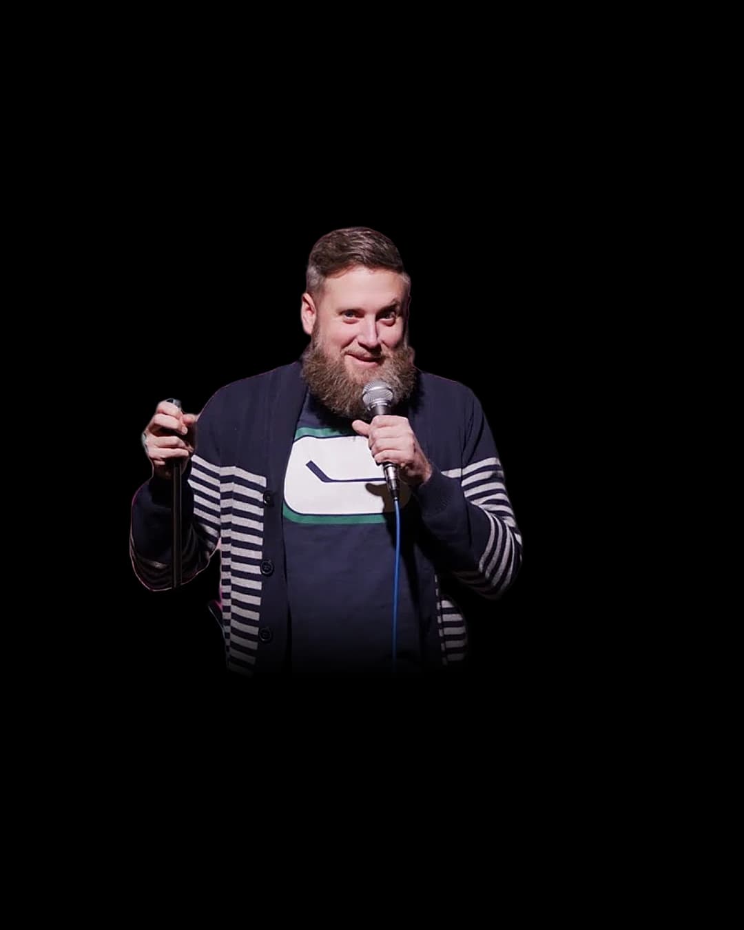 Dave Harris on stage with a microphone